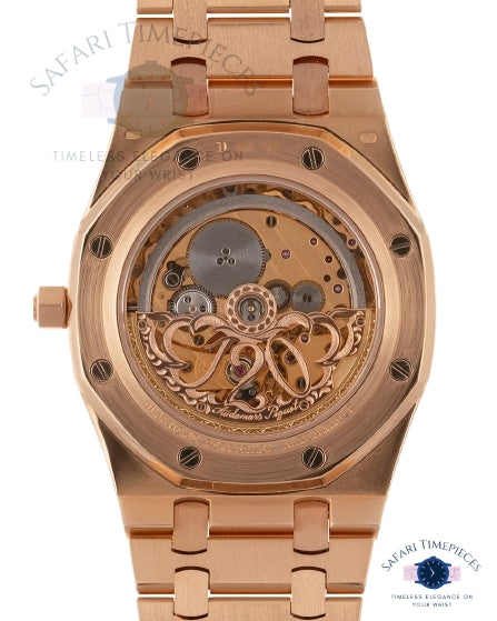 Rose gold watch with visible mechanical components on a white background, branded 'Safari Timepieces'.