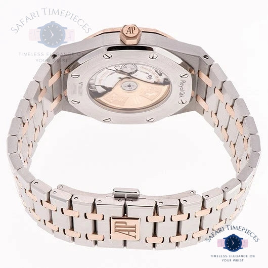 Rose gold and silver watch with visible brand logo on a white background