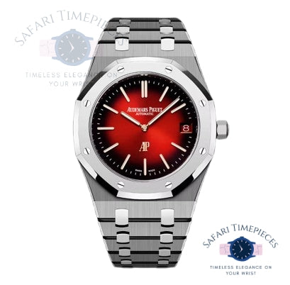 Watch with red face and silver metal strap on white background