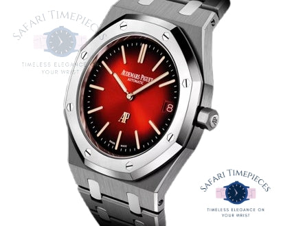 Watch with red face and silver case on a white background