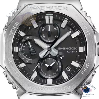 Casio G-Shock watch with silver case and black dial on a white background