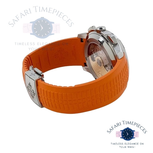 Watch with orange strap and silver case on a white background, branded 'Safari Timepieces'.