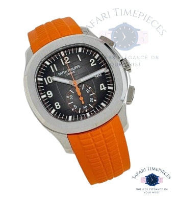 Watch with orange strap and black dial on a white background, featuring 'Patek Philippe' branding.