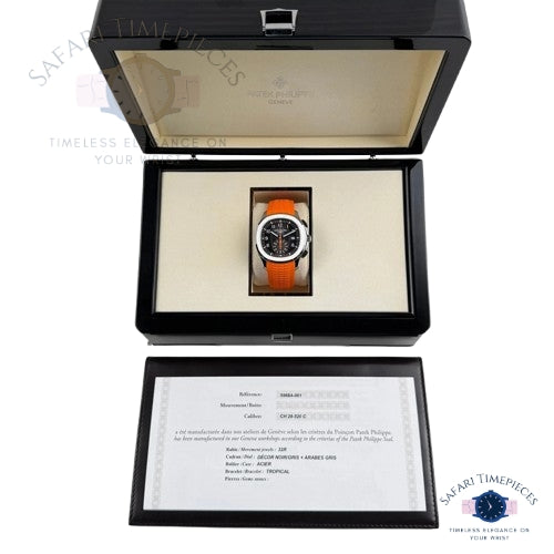 Orange watch in a black display case with 'Safari Timepieces' branding.