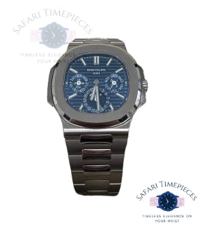 Luxury watch with blue face and metallic band on a white background, branded 'Patek Philippe'.
