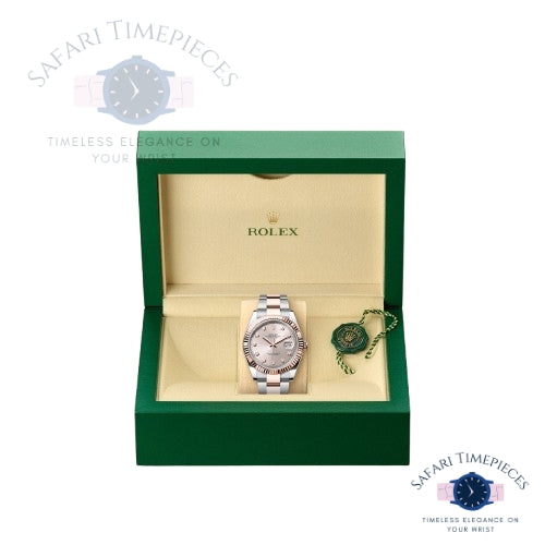 Rolex watch in a green box with 'Safari Timepieces' branding.