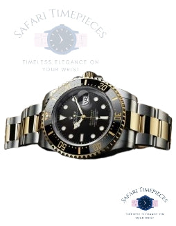 Two-tone Rolex luxury watch with black face on a white background