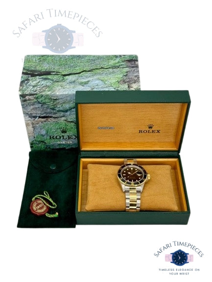 Rolex watch in a green and gold box with a green and brown patterned paper on a white background.