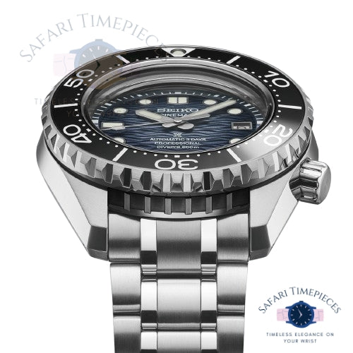 Seiko watch with silver bracelet and black dial on a white background