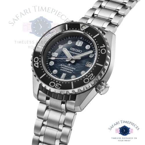 Seiko watch with black dial and silver metal bracelet on a white background