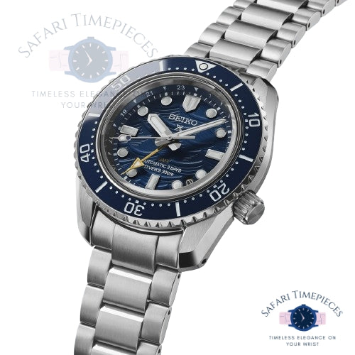 Seiko watch with blue dial and silver metal bracelet on a white background