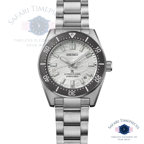 Silver Seiko watch with grey bezel on a white background