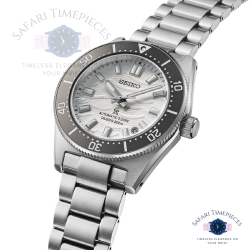 Silver Seiko watch with black bezel on a white background