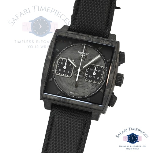 Black Tag Heuer Monaco Flyback watch with detailed face on a white background, featuring 'Safari Timepieces' branding.