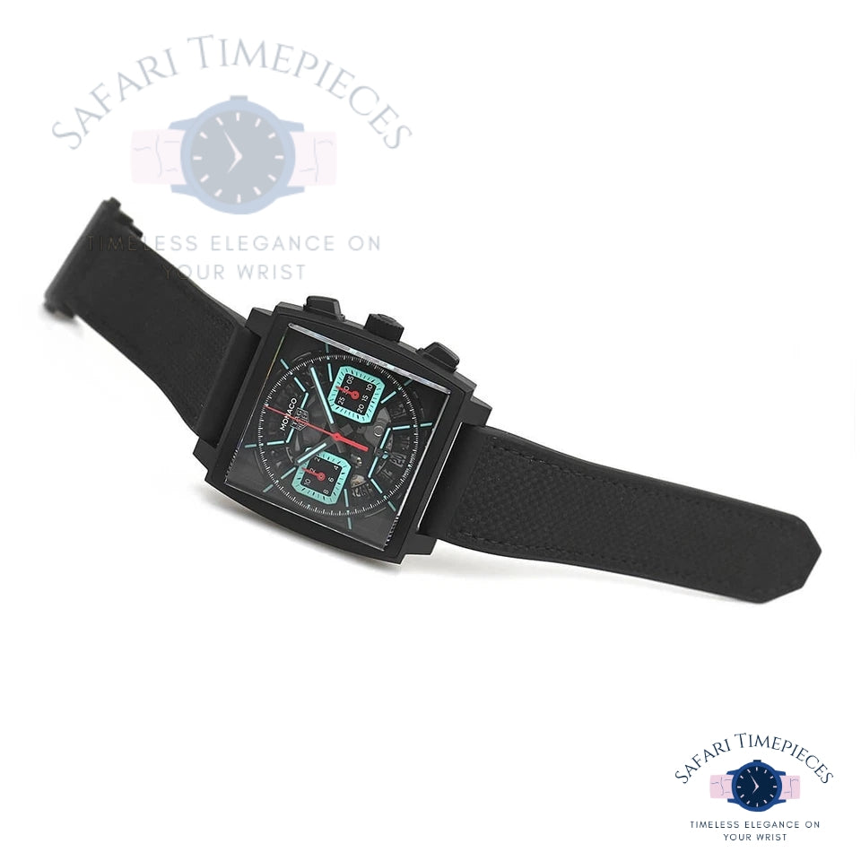 Black Tag Heuer Monaco Skeleton wristwatch with digital display on a white background, featuring 'Safari Timepieces' branding.