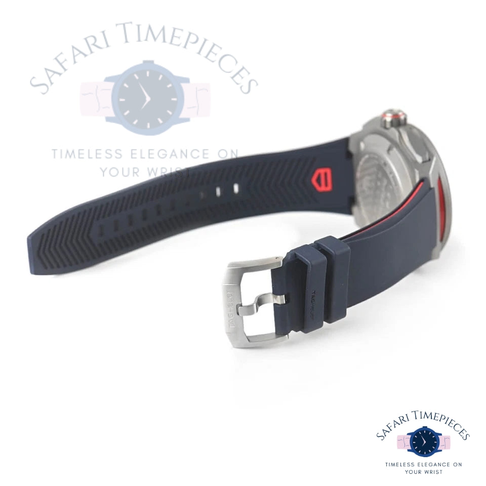 Watch with navy blue strap and silver case on a white background, branded 'Safari Timepieces'.